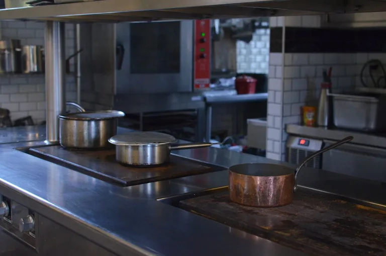 Stainless steel range and cooking equipment in a commercial kitchen