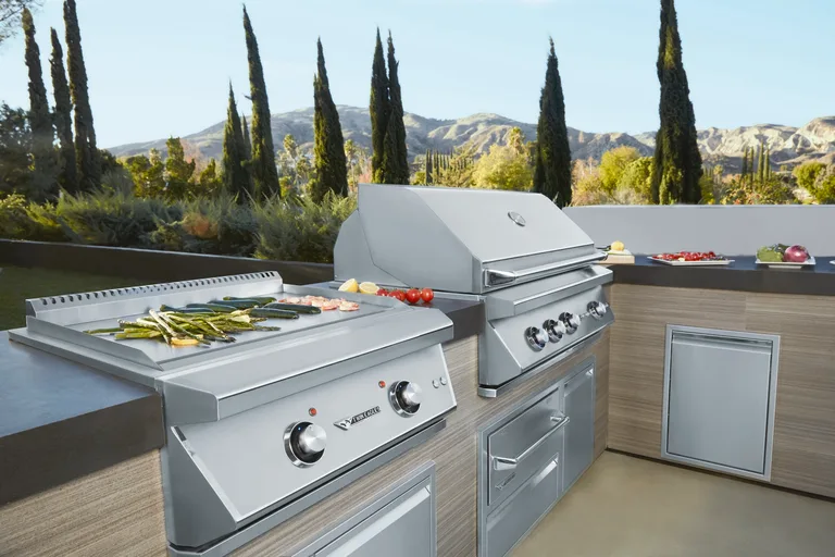 Stainless steel Twin Eagles grill and griddle, shown as an equipment example